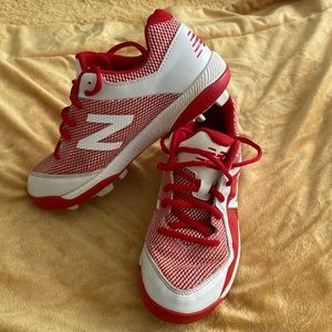 Boys size 5 New Balance Cleats. Red and white